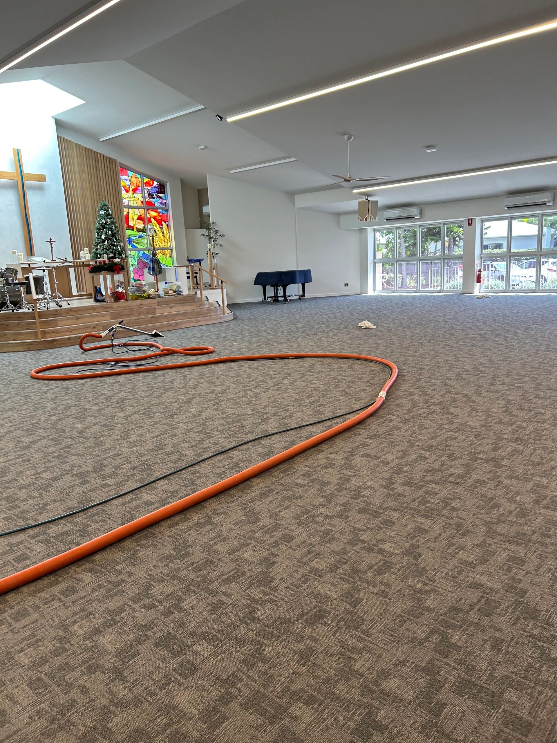 Commercial carpet cleaning in progress — professional results